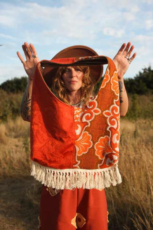 Boho fringed slouchy bag in 70's orange fabric with fringing.